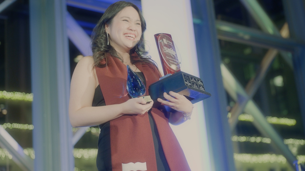 JDC West gala award winner on stage holding trophies